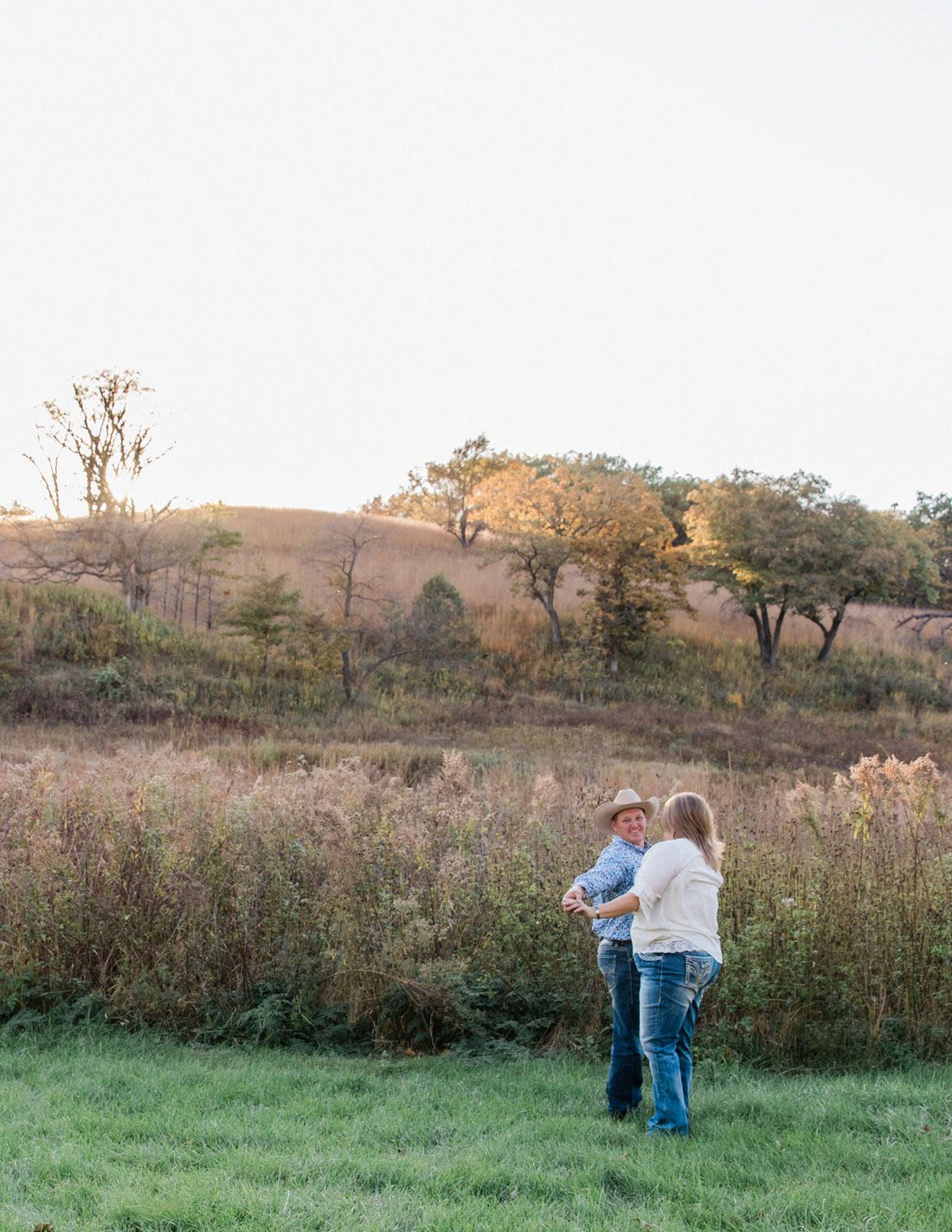 Carrie and Nate dance in the field by the barn.